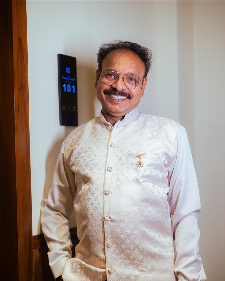 Portrait of Prabhakaran, sole proprietor and senior painter of Yours Automobile in Mylapore, wearing a cream kurta